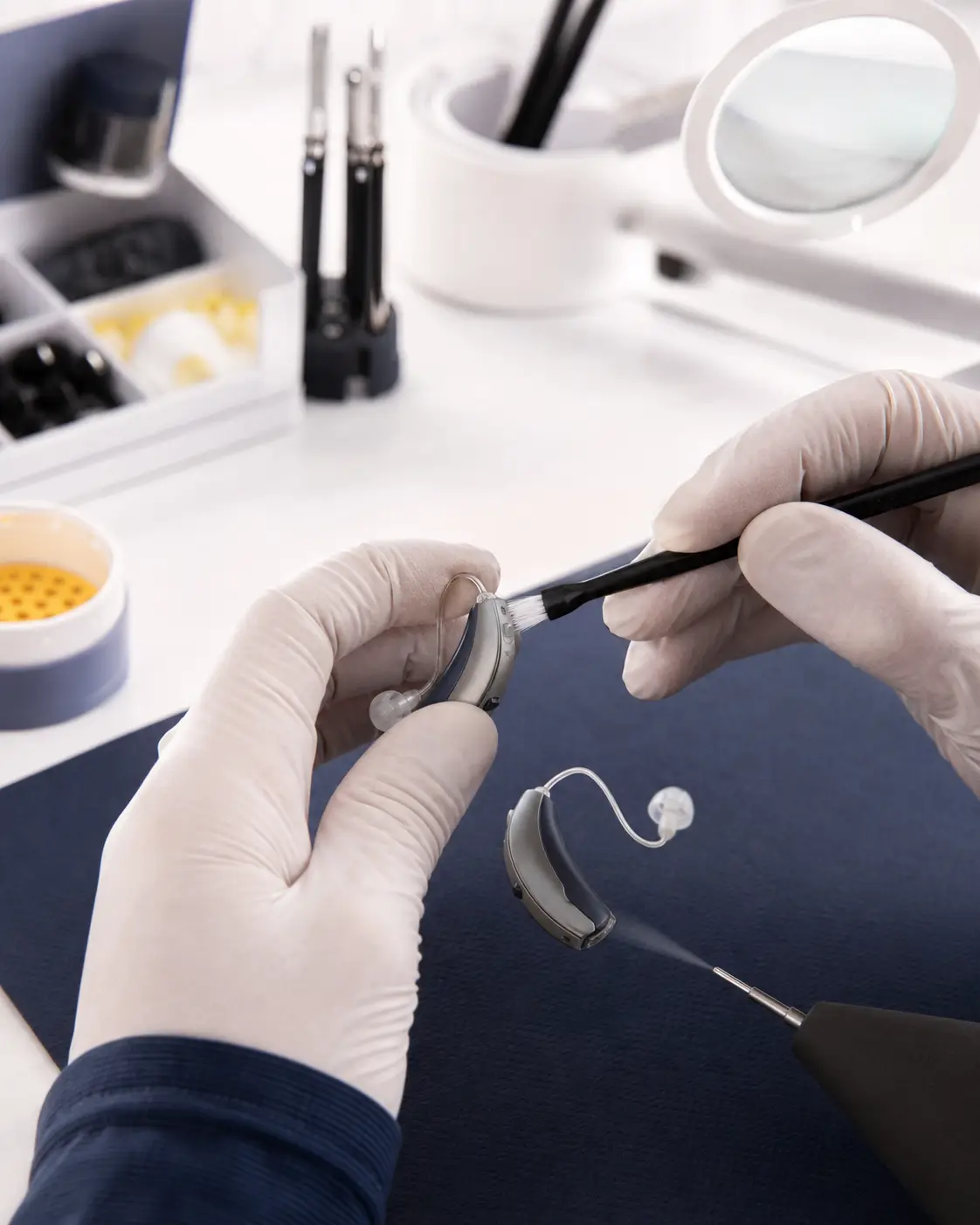 Hearing aid cleaning and maintenance